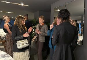 Guests enjoy lively conversations, exchanging fresh ideas in an elegant setting.