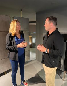 A warm exchange unfolds as guests connect during the gathering.