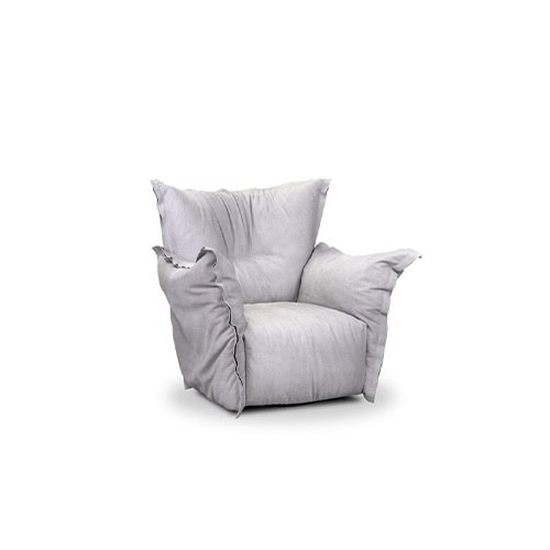 Plush modern armchair with oversized cushions and soft light grey upholstery, featuring relaxed seams and a deep seat for comfort.