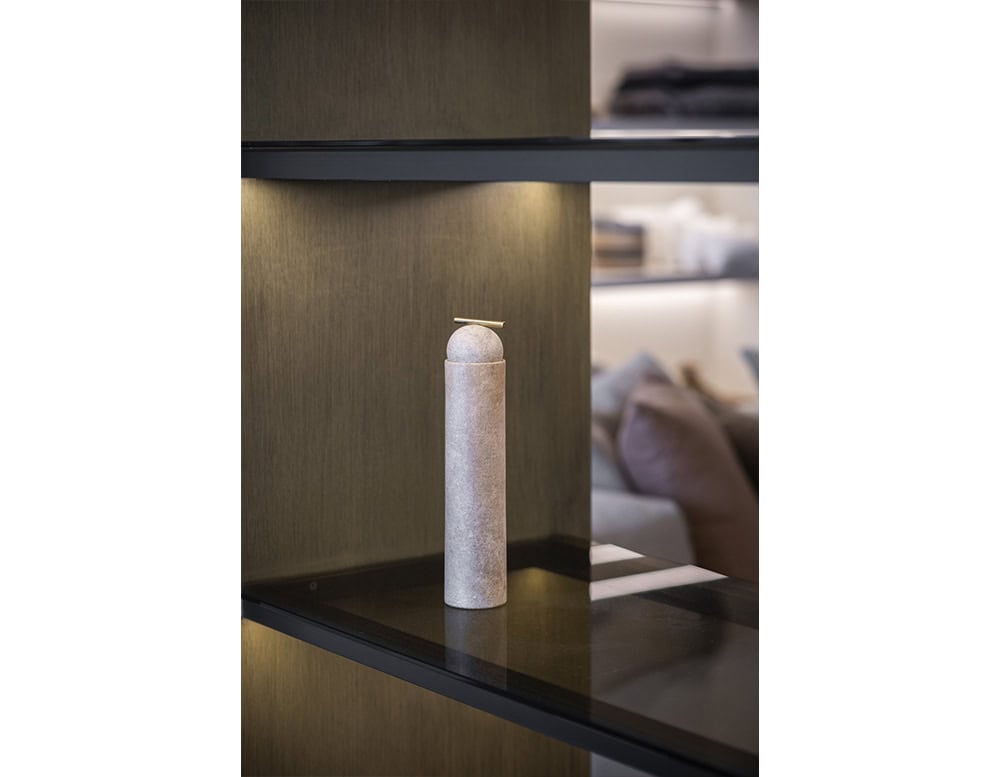 AOI Vase blends minimal cylindrical form with sculptural presence crafted in stone with a refined top accent ideal for modern displays and interiors.