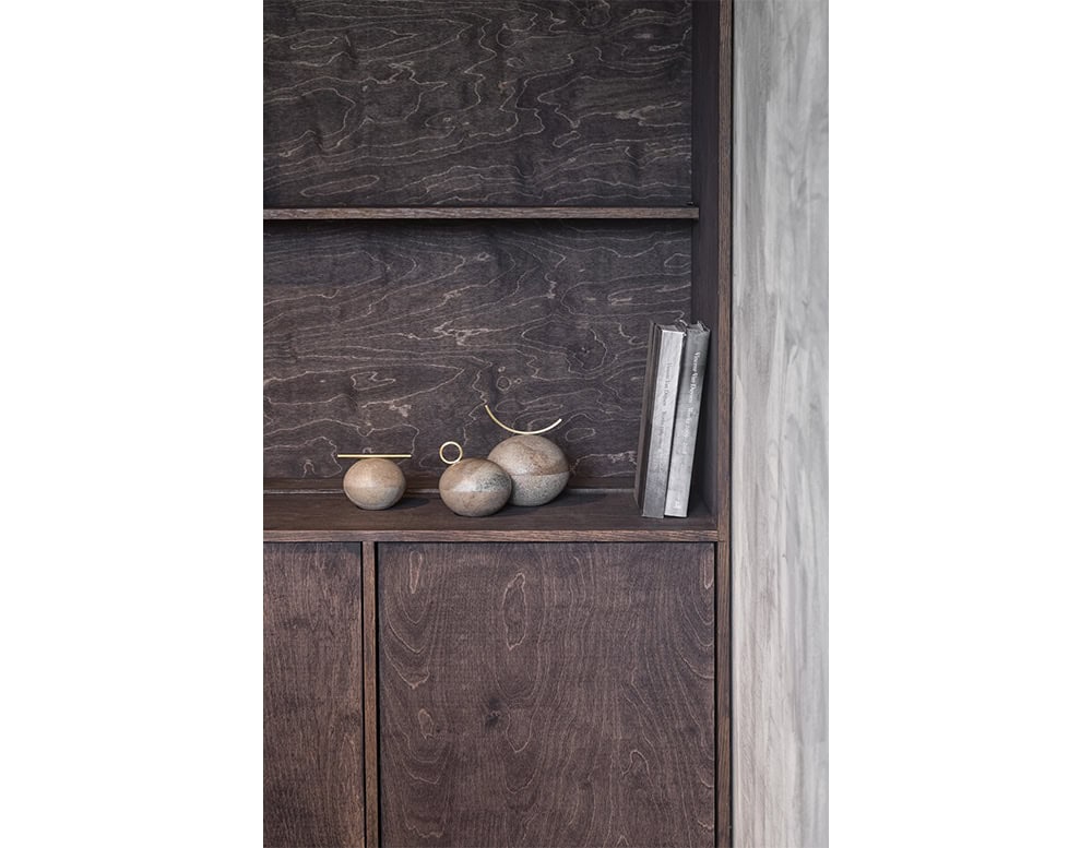 Bola Sabao Accessories are sculptural stone spheres in warm beige hues, accented with brass details that bring balance and refinement to any interior.