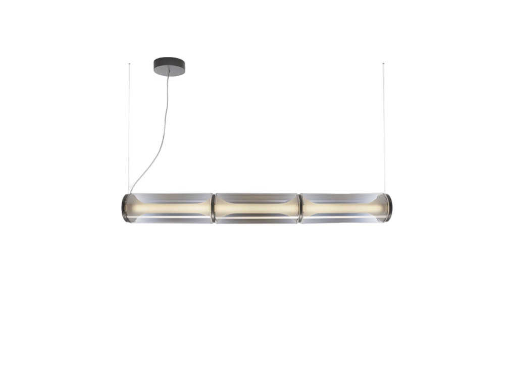 Las Miles Lighting features three sleek cylindrical glass diffusers suspended to cast a warm, even glow. Its minimal, refined design adds a touch of sophistication to modern interiors.