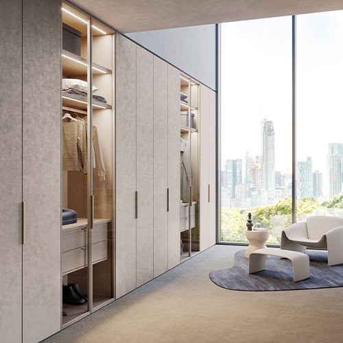 This elegant wall unit features full-height panels and integrated lighting, creating a sleek wardrobe solution with a minimalist aesthetic.