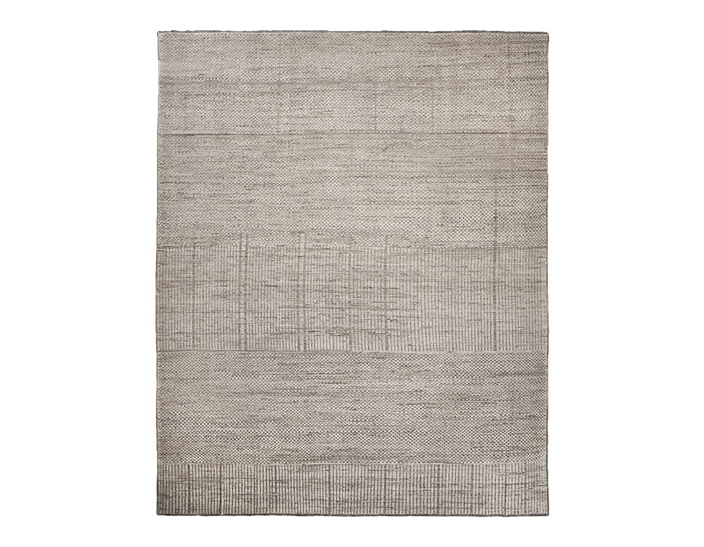 Sah Sidi Rug features a subtle grid design in warm neutral hues. Its refined texture and understated elegance bring a sense of harmony, making it ideal for enhancing both contemporary and classic interiors.