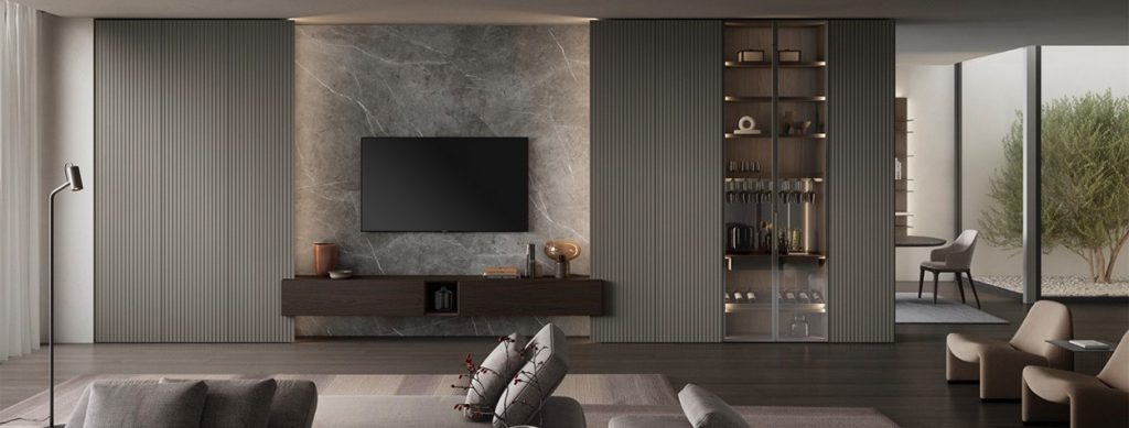 This elegant installation showcases refined Italian craftsmanship with hidden compartments, illuminated display shelves, and a media ready marble accent wall that seamlessly blends style and practicality.