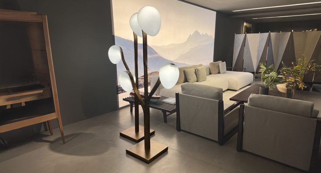 Sculptural floor light featuring branching bronze stems topped with softly diffused white glass shades. The warm metallic base and organic form create a refined ambient glow, adding elegance and visual interest to contemporary living spaces.