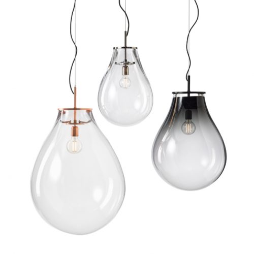 Elegant suspension lights featuring softly rounded glass shades in clear and smoked finishes. Paired with refined metal details, they create a light, airy presence while showcasing the bulb as a central design element.
